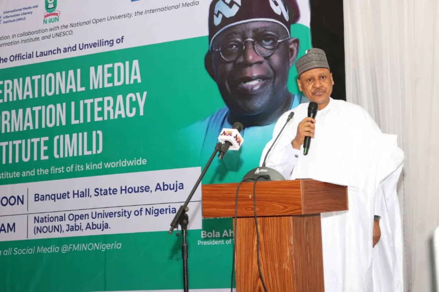 Federal Government official speaking at the IMILI launch ceremony in Abuja